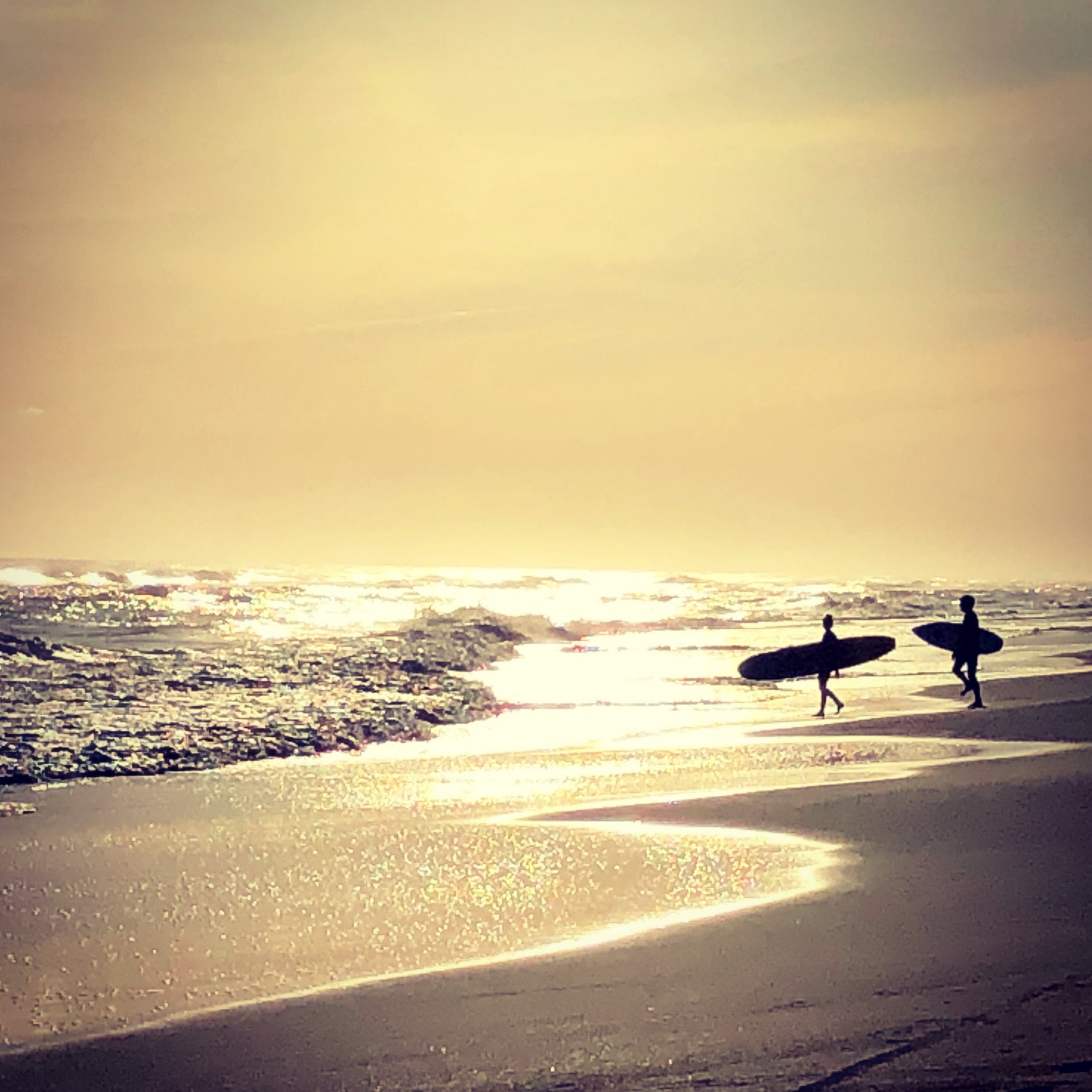 two surfers at Frisco beach on Cape Hatteras