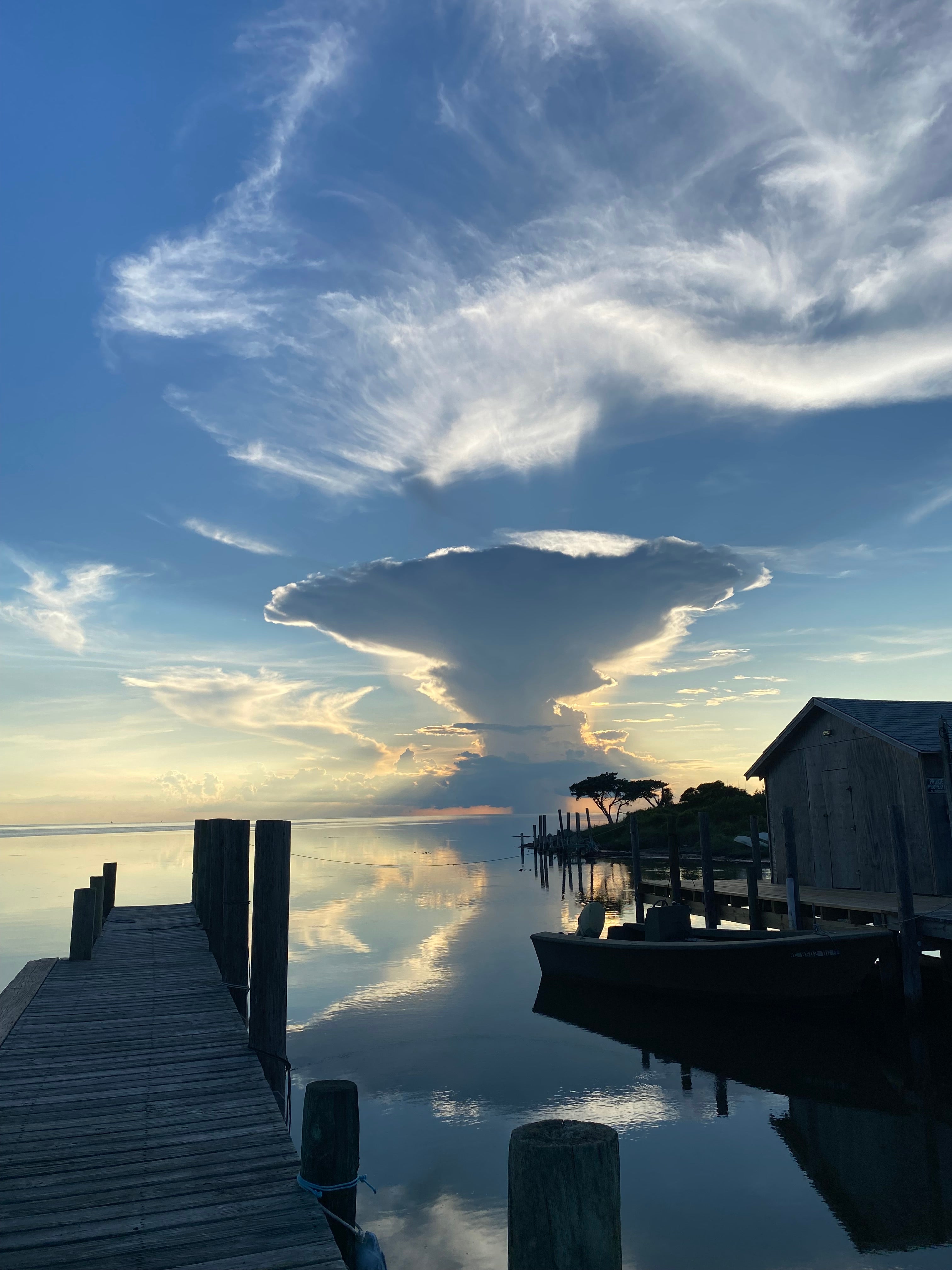 Sunset behind large cloud at Avon Harbor Pamlico Sound