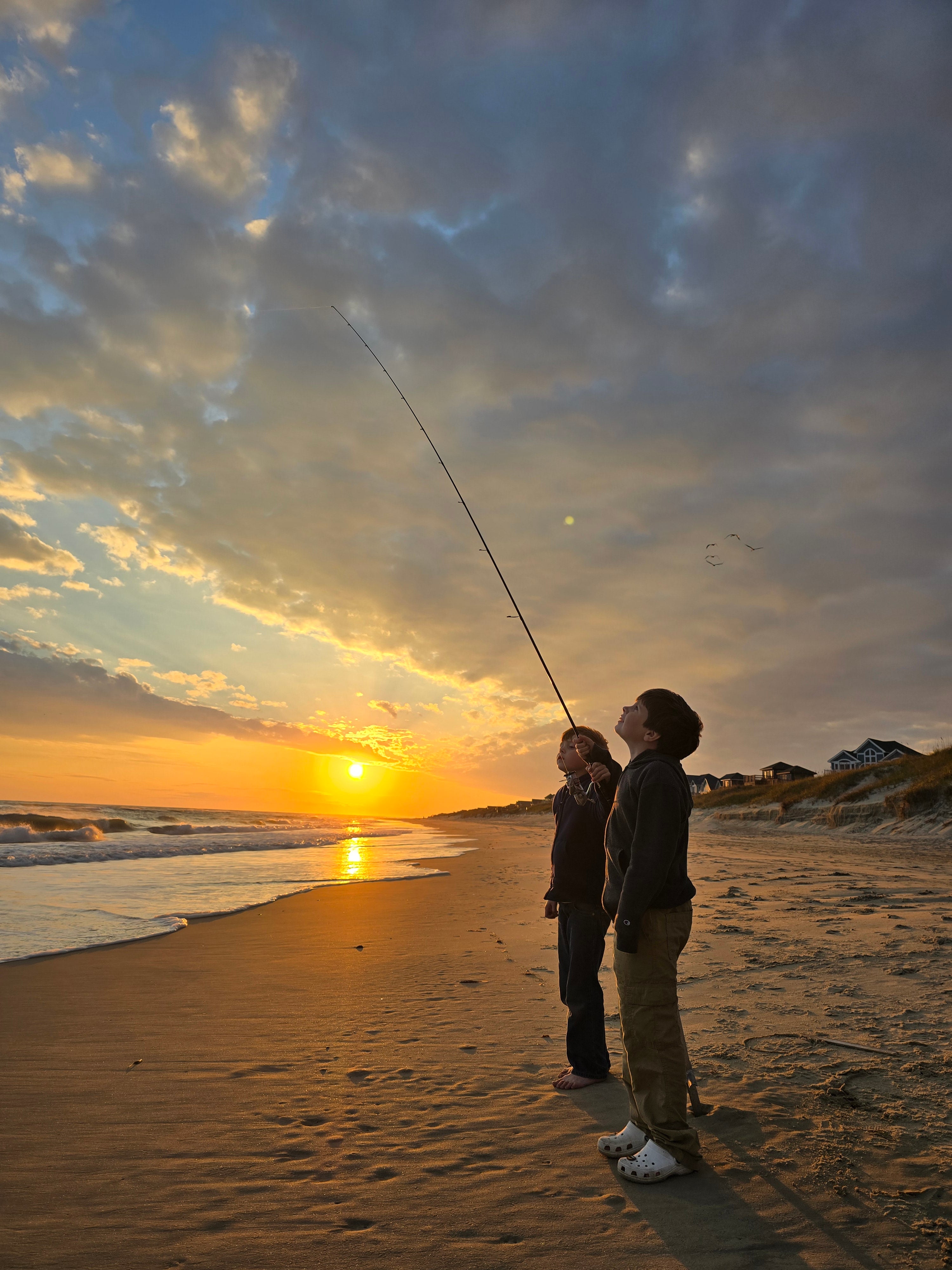 Boys fishing at the beach on Cape Hatteras National Seashore