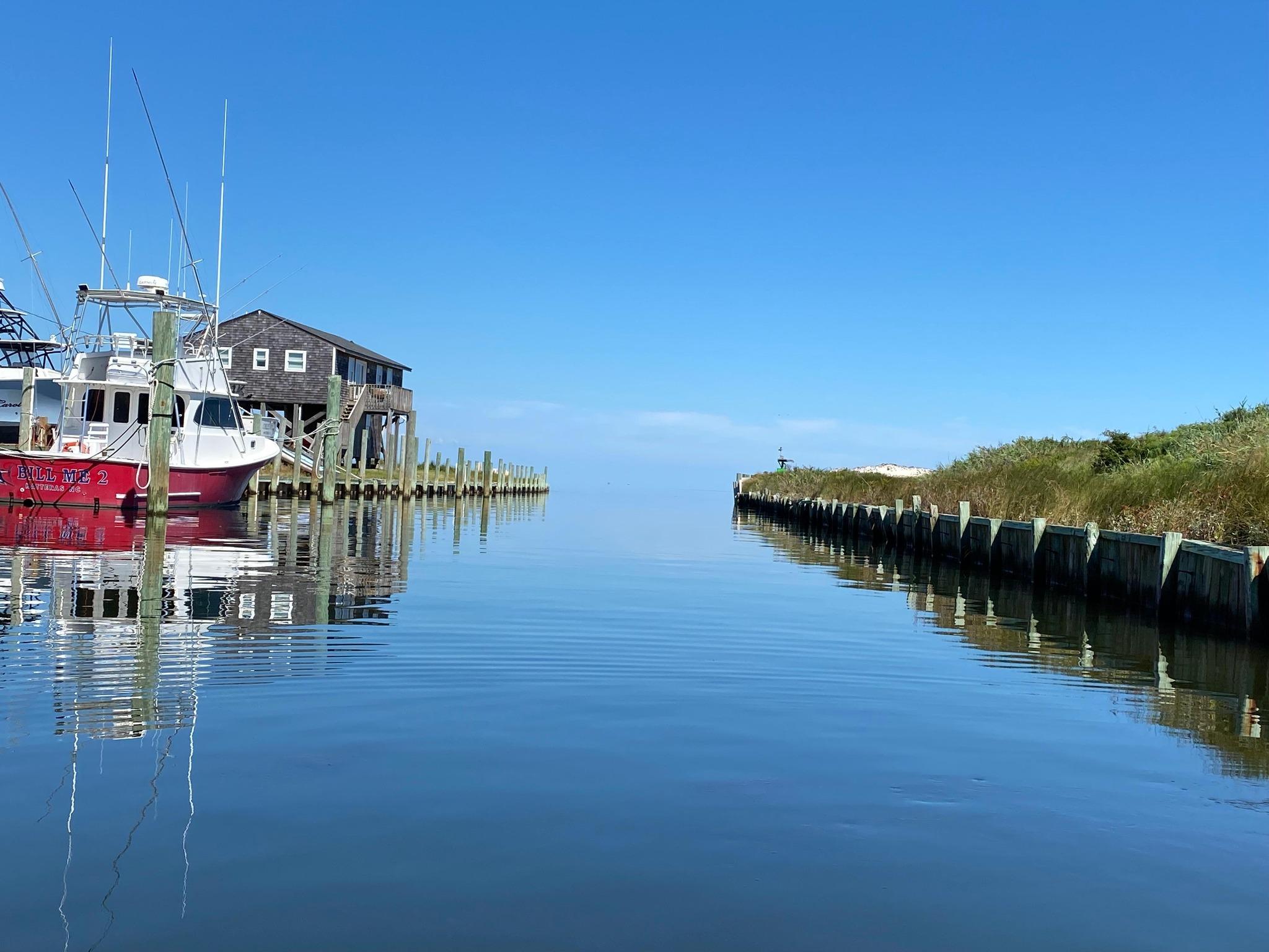 Calm water at the Buxton harbor with boat