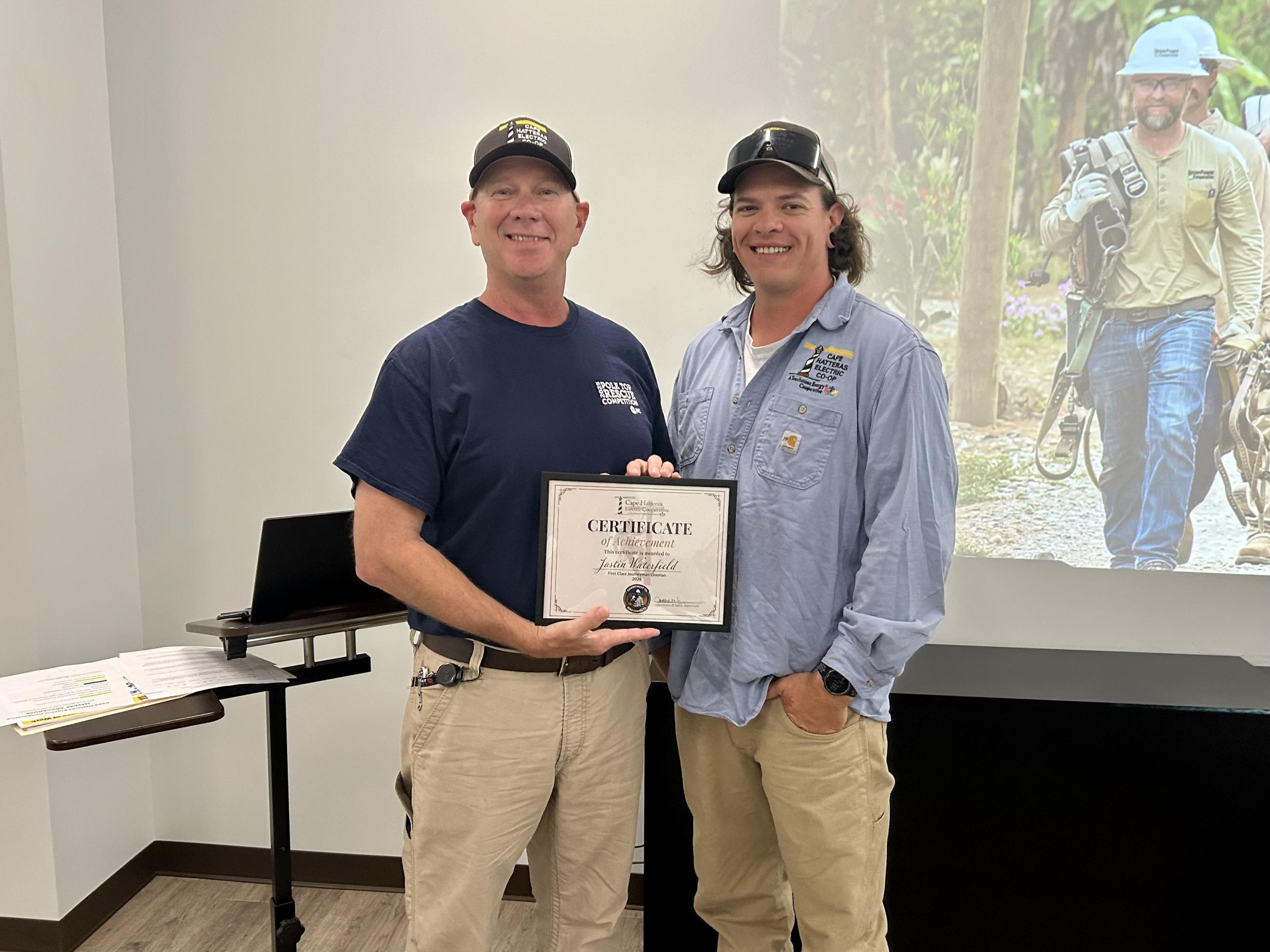 CHEC lineman Justin Waterfield with Operations supervisor Jonathan Vernesoni