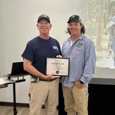 CHEC lineman Justin Waterfield with Operations supervisor Jonathan Vernesoni